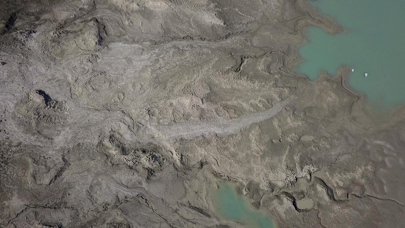 Aerial view of a glacial plain and meltwater lake