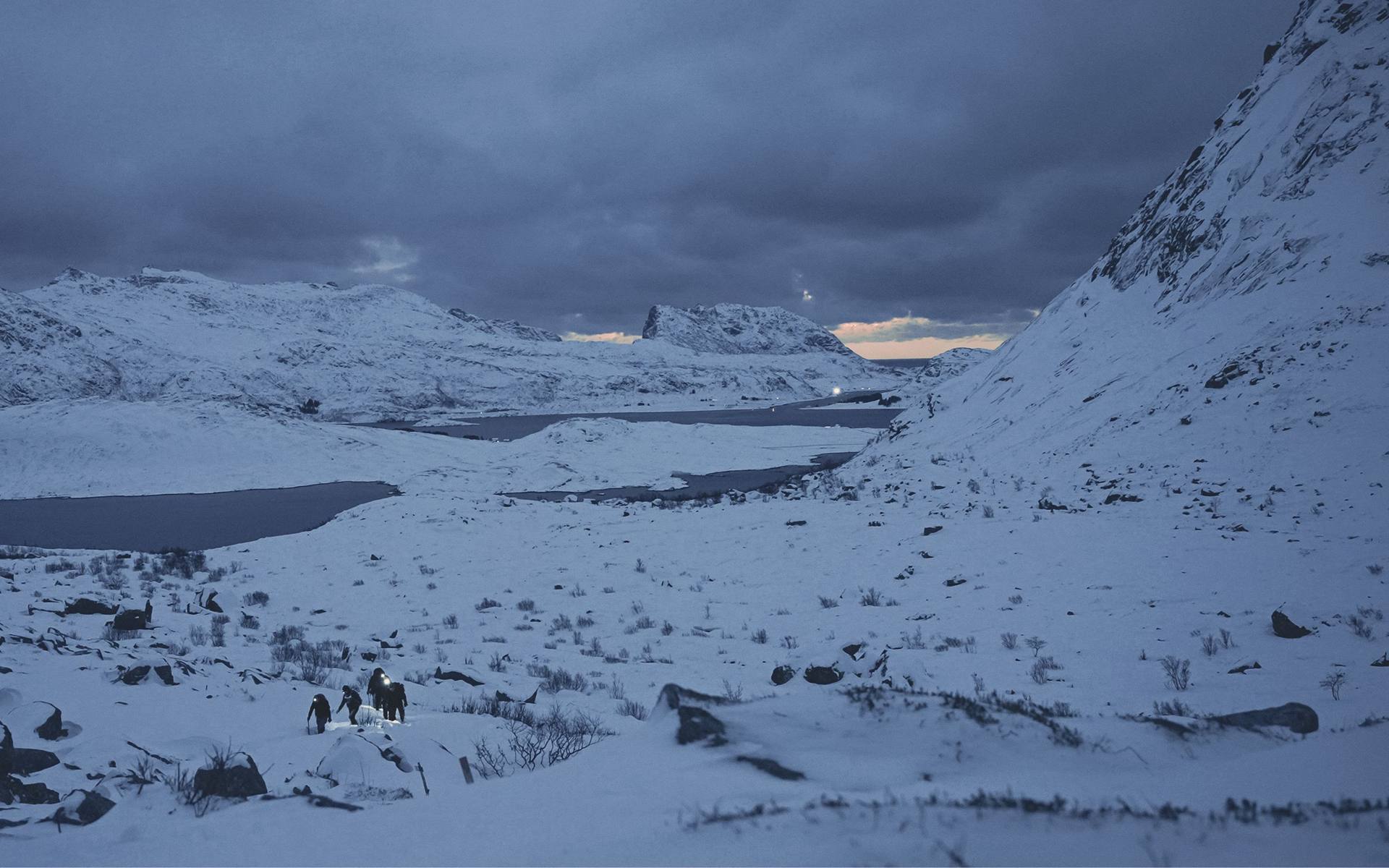 The team crossing a snowy valley in the Lofoten Islands